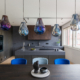 a kitchen with a table, chairs and pivot door